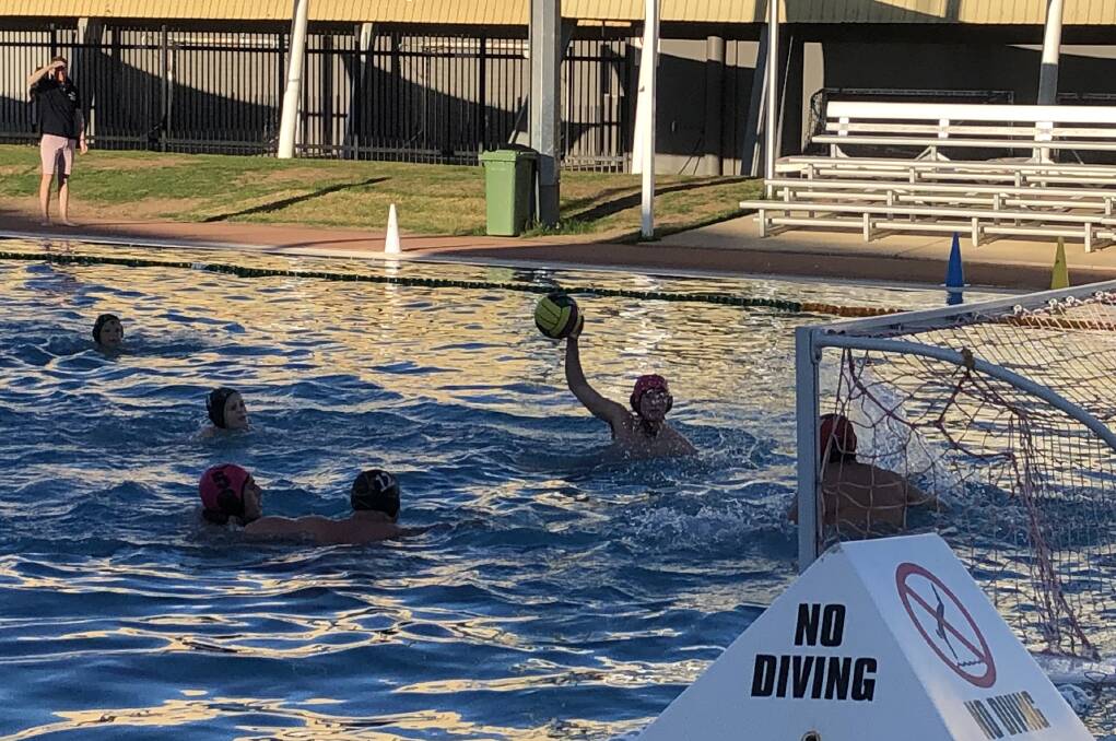 RARE SIGHTING OF LIVE SPORT: Octopuses v Raiders in the men's sudden death semi-final on Tuesday night as Wagga Water Polo shortened its finals in the hope of playing for premierships on Saturday. 