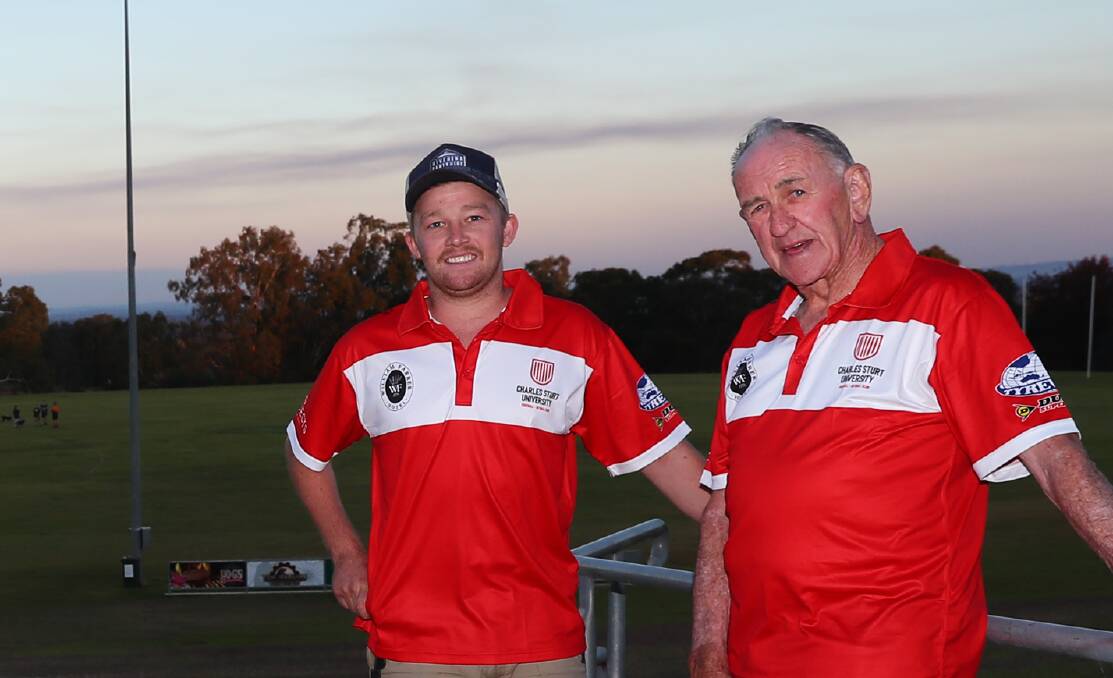 Current Bushpigs president Cam Humphries, left, at Peter Hastie Oval with original coach, Ivan Carroll, for the club's 50 year celebrations earlier this year. 