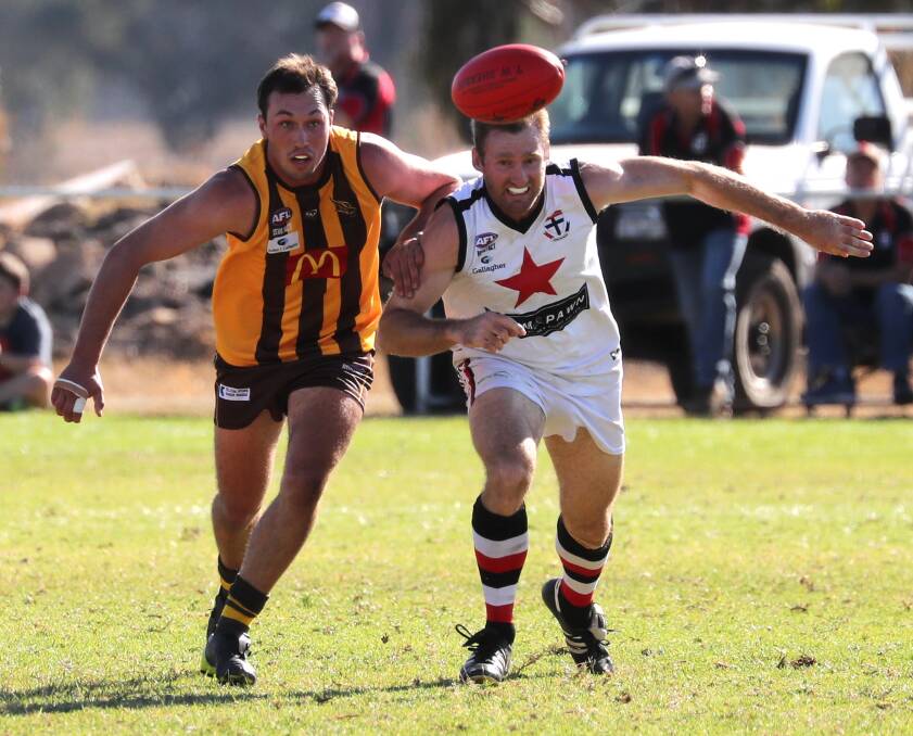 EYES ON THE PRIZE: East Wagga-Kooringal forward Jacob Tiernan and North Wagga backman Luke Walsh compete at Gumly. Picture: Les Smith