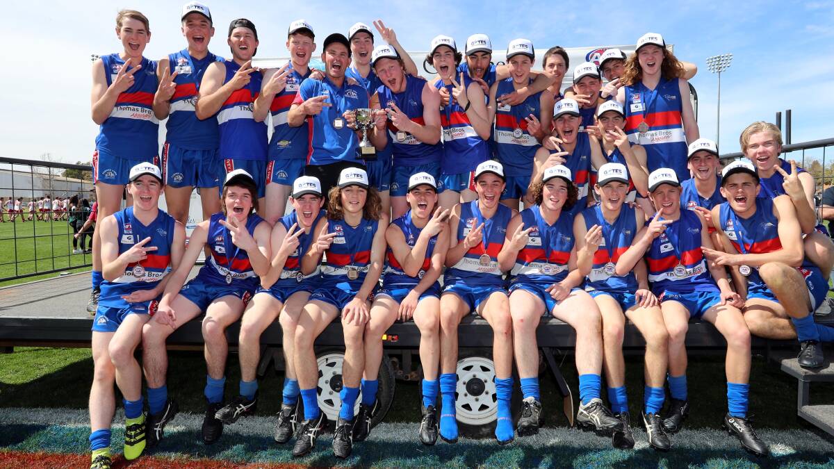 BACK-TO-BACK: Young Bulldogs celebrate their dominant win in the Under 17.5 grand final. Picture: Les Smith