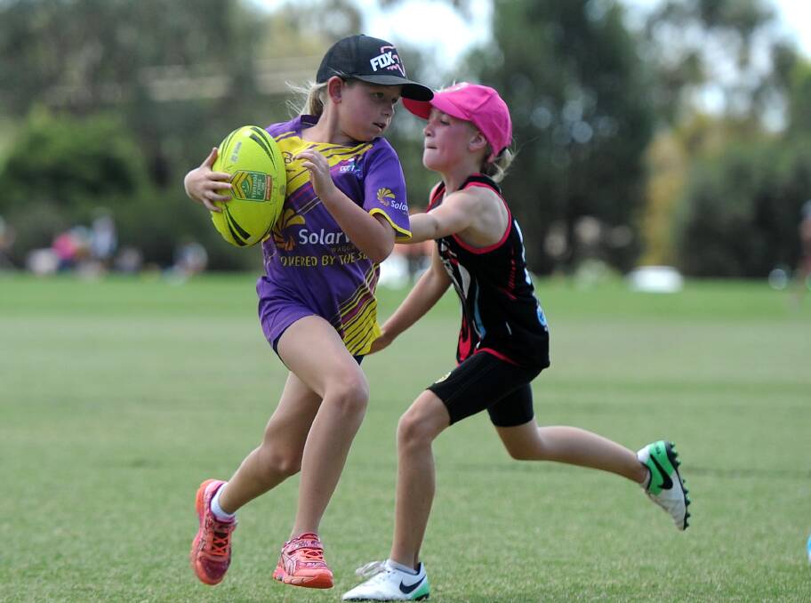 HOPEFUL: Action from last year's under 10 girls grand final. Touch officials are hopeful this year's junior grand final day will go ahead despite Thursday's rain. 