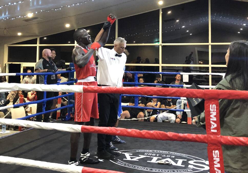 FIGHT DELIGHT: Regarn Simbwa's arm is raised in victory following his first bout in Australia in the headline act of Saturday night's Boxing at the Lake. Picture: Peter Doherty