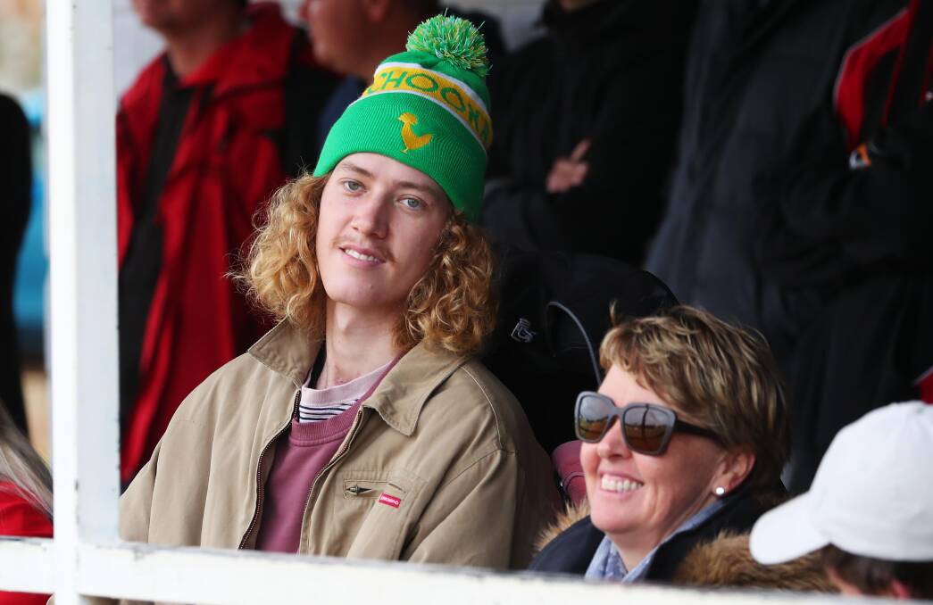 DAY OUT: Josh Hanlon with mum Leanne at North Wagga's Farrer League semi-final at Maher Oval on Saturday. Picture: Emma Hillier