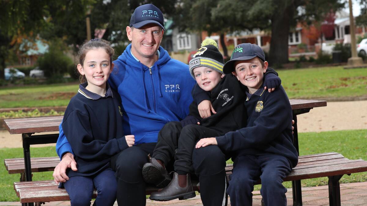 HAPPY DAYS: Magpies veteran David Pieper with his children, Andie, 9, Lane, 4, and Lenny, 10. Picture: Les Smith