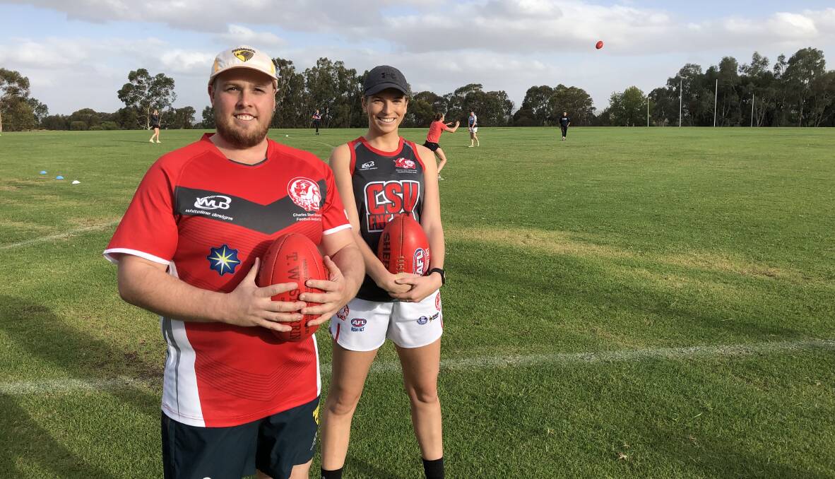 GRAND FINAL EXCITEMENT: Charles Sturt University coach Clinton Blake and ruck Chloe Hinde as the Bushpigs prepared for another grand final this week. Picture: Peter Doherty