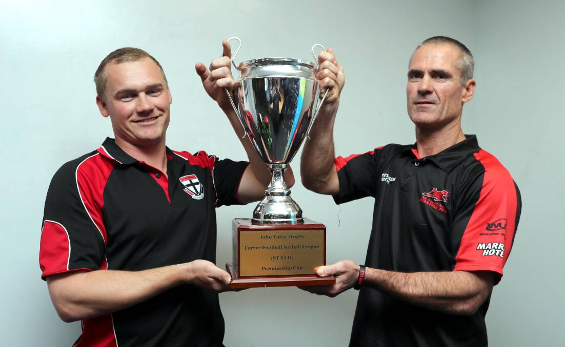 THE PRIZE: North Wagga coach Kirk Hamblin and Marrar counterpart Shane Lenon with the trophy ahead of Saturday's Farrer League grand final. Picture: Les Smith