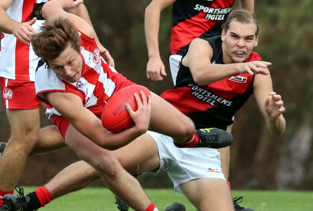 Marrar's Adam Whyte (right) in a bump with CSU's Lou Miller last year. Miller moved to Ganmain-Grong Grong-Matong in the off-season, while Whyte went to North Albury but university changes will see him back at Langtry Oval. 