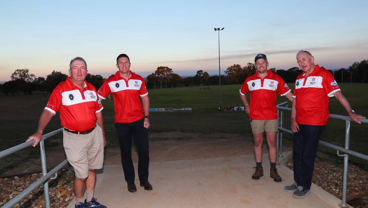 CARRYING ON A TRADITION: Rivcoll's first president Maurie Hogan (left) and coach Ivan Carroll (right) at training this week with current coach Travis Cohalan and president Cam Humphries.