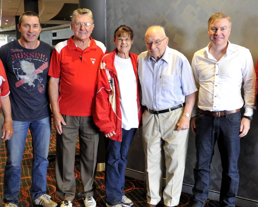 Yates in 2014 at a Sydney supporters function in Wagga, including Swans legend Paul Kelly (left) and chairman Andrew Pridham.