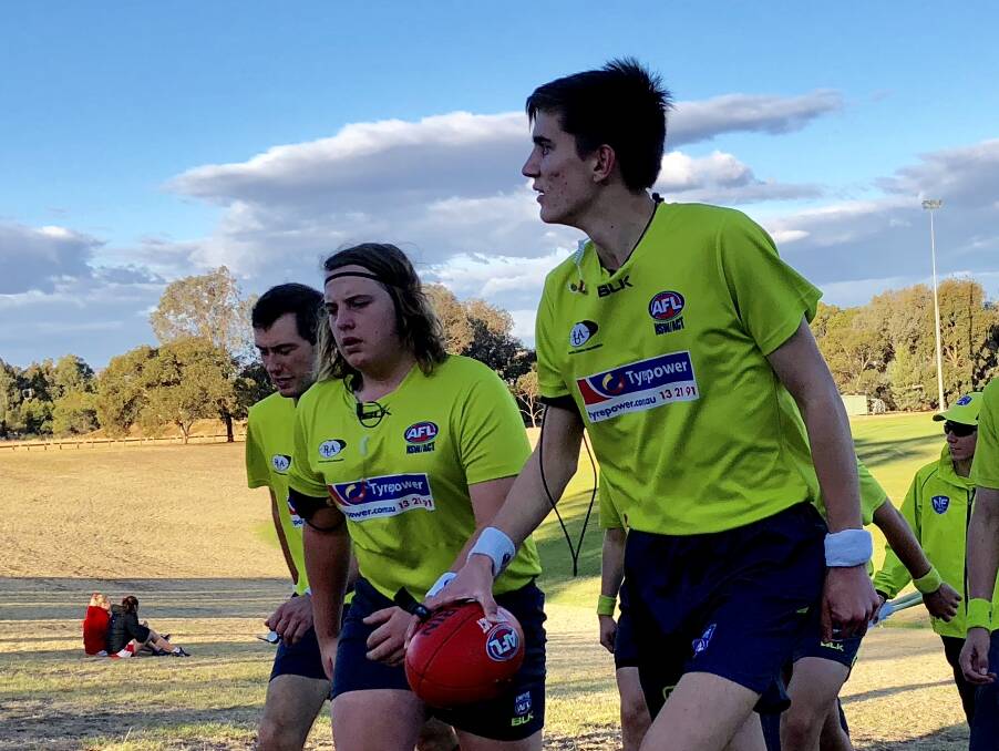 WIRED UMPS: James Forwood (right), Cain Davey (centre) and Andrew Tuovi (left) wore the technology in last week's Farrer League game at Peter Hastie Oval.  
