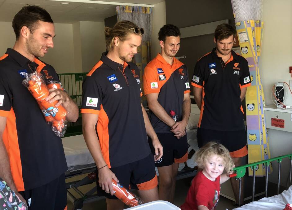 Finlayson, Himmelberg, Sproule and Flynn tour the children's ward.