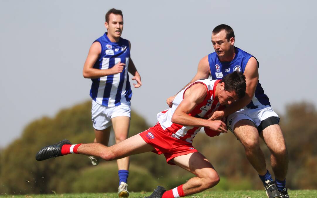 CSU's Will Stewart is halted by Liam Pattison in the Bushpigs' loss to Temora last week. Picture: Emma Hillier