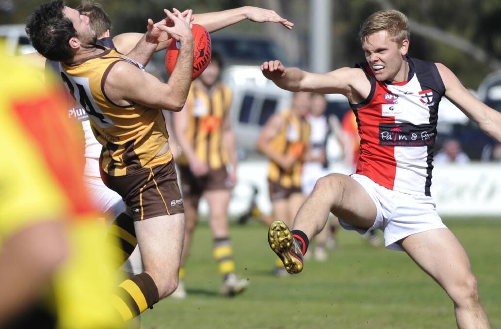 KUNG-FU FIGHTING: North Wagga's Brayden Skeers left no stone unturned in his battle with East Wagga-Kooringal's Marc Geppert. Picture: Les Smith