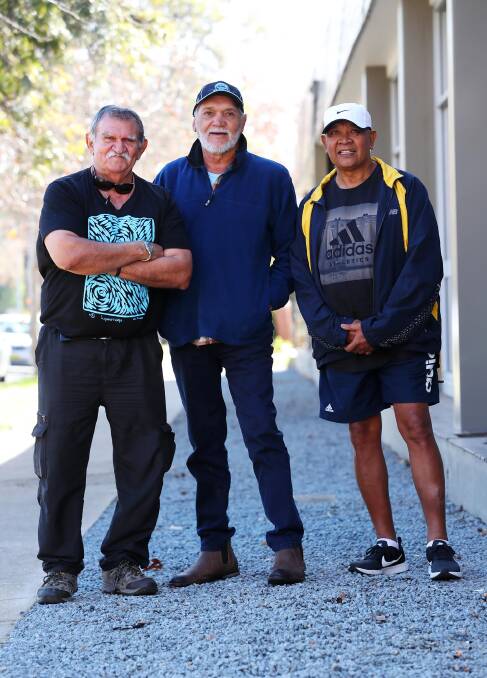 The three former Lockhart teammates are looking forward to rekindling old friendships and remembering an eye-opening experience for young footballers in their early 20s. Picture: Emma Hillier