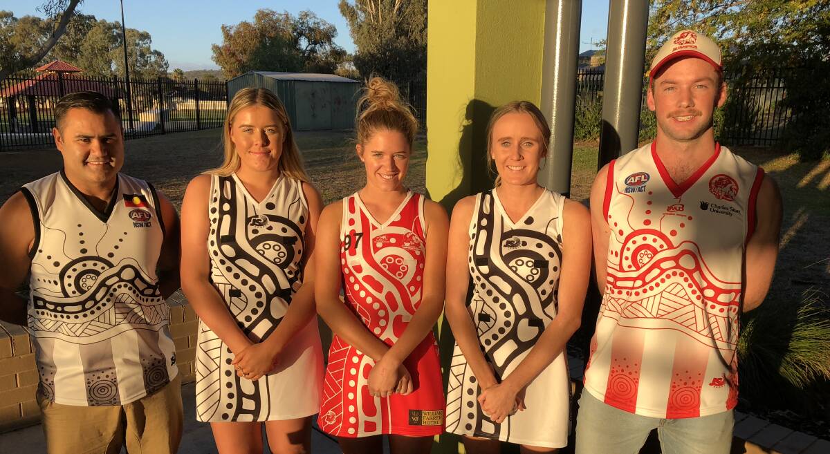 RECOGNITION: TRYC's Derek Murray (left) with netballers Kadison Hofert (TRYC), Isobel Cleary (CSU), Ella Fellows (TRYC) and Bushpig Diarmid Cleary in the respective Indigenous strips the teams will wear on Saturday. 