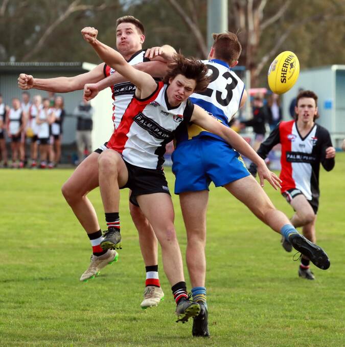 CLASH OF BODIES: Farrer League club North Wagga took on Mangoplah-Cookardinia United-Eastlakes last weekend. They could yet do battle for premiership points in a combined league this season after a dramatic week in AFL Riverina. 
