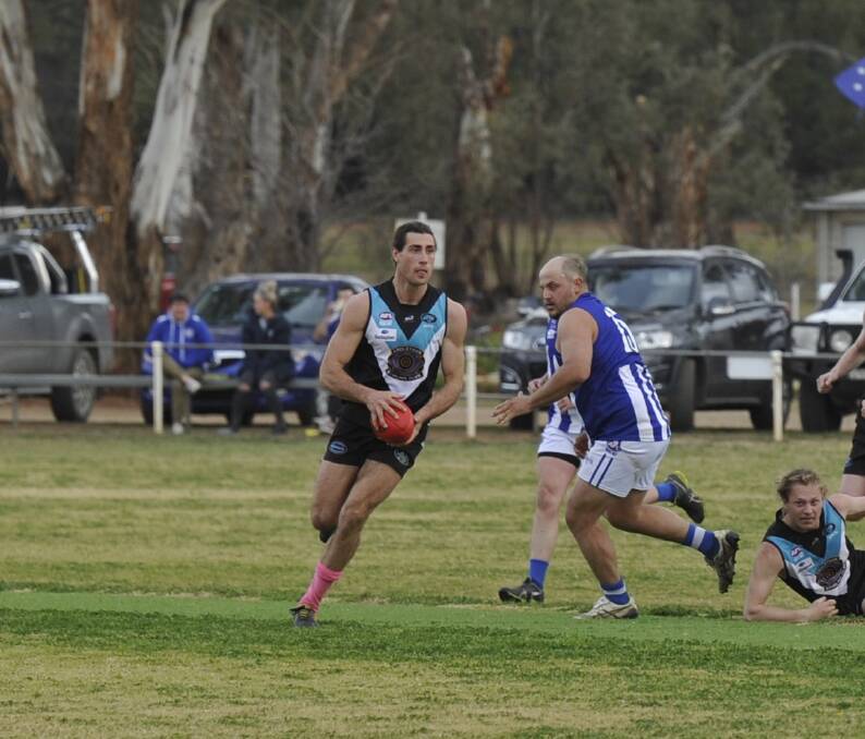 BIG SEASON: Northern Jets coach, Mitch Haddrill, on the move through the midfield against Temora this year. The midfielder claimed both the club and league best-and-fairest awards.