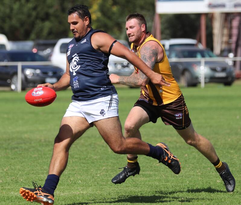 GOING FORWARD: Coleambally's Dwayne Weetra and East Wagga-Kooringal's Trent Garner in the opening round of last year's competition. 