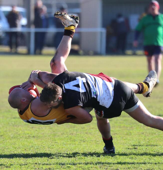 North Wagga forward Daniel Jordan upends East Wagga-Kooringal's Chris Hommes. Picture: Les Smith