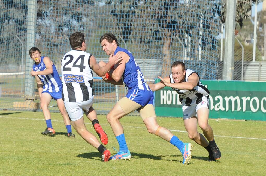ON THE CHARGE: Temora forward Matt Wallis attempts to take on TRYC's Lachy Myers at Nixon Park on Saturday. 