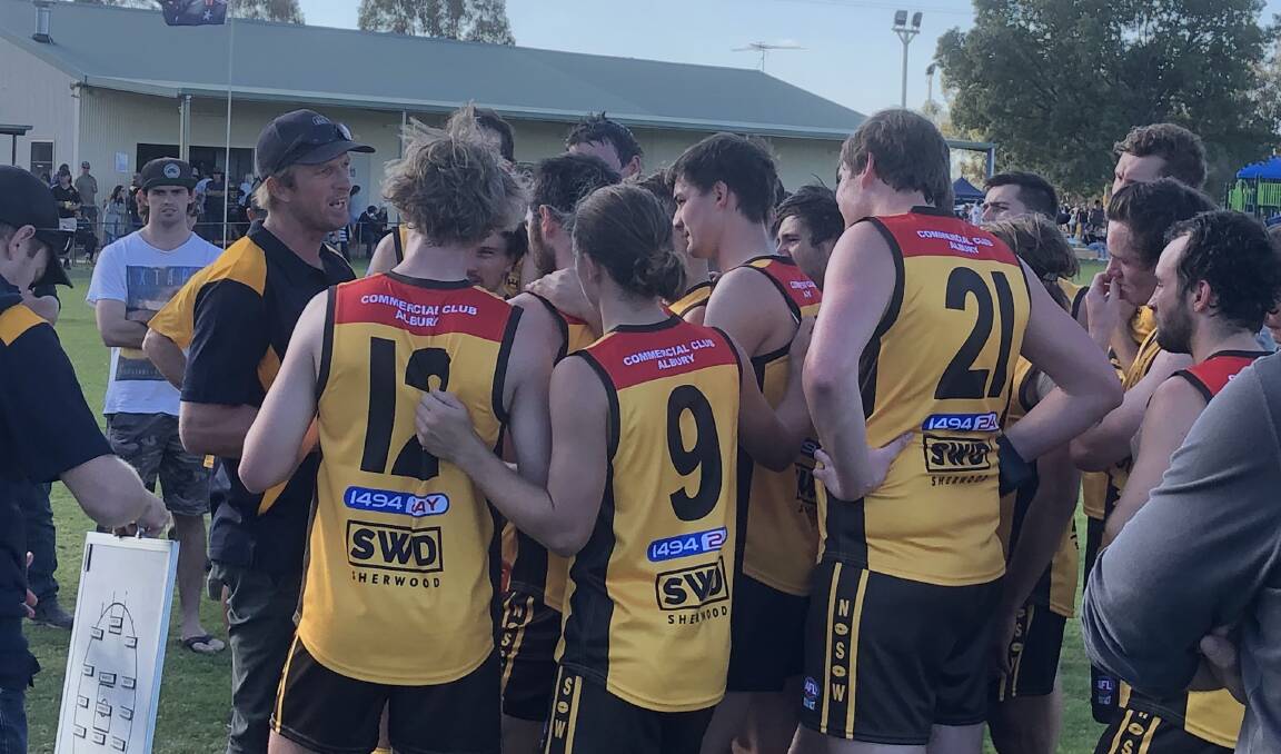 Brent Piltz addresses his Hume League team at quarter-time. Picture: Peter Doherty