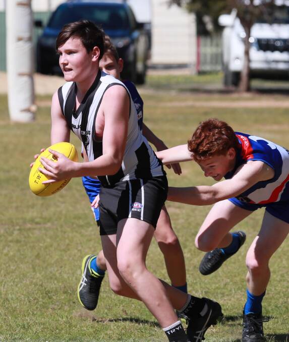 JUNIORS LINK: TRYC's Harry Hopkins on the charge for the Magpies' under 13s this season. Picture: Les Smith