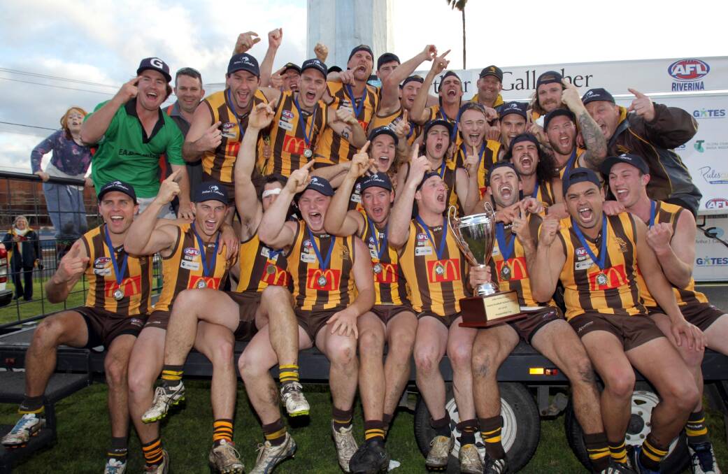 HOW GOOD'S IT FEEL? Gavin McMahon's Hawks celebrate their grand final success. Picture: Les Smith