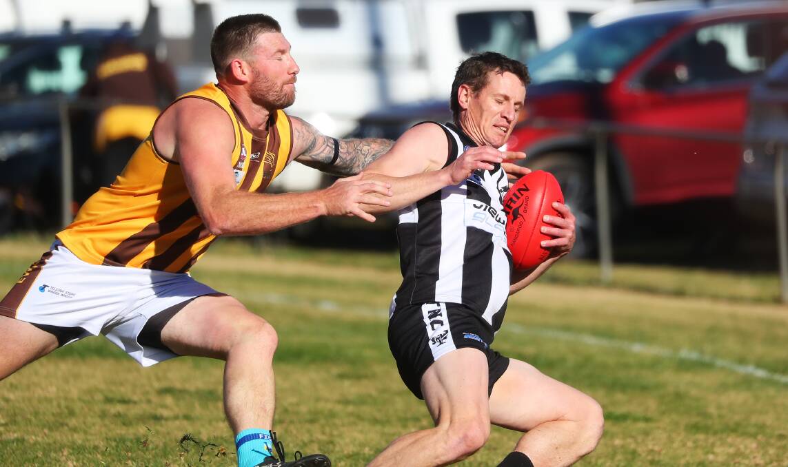 UNDER PRESSURE: East Wagga-Kooringal's Trent Garner isn't giving Magpie Scott Wolter any space at Victoria Park, The Rock on Saturday. Picture: Emma Hillier