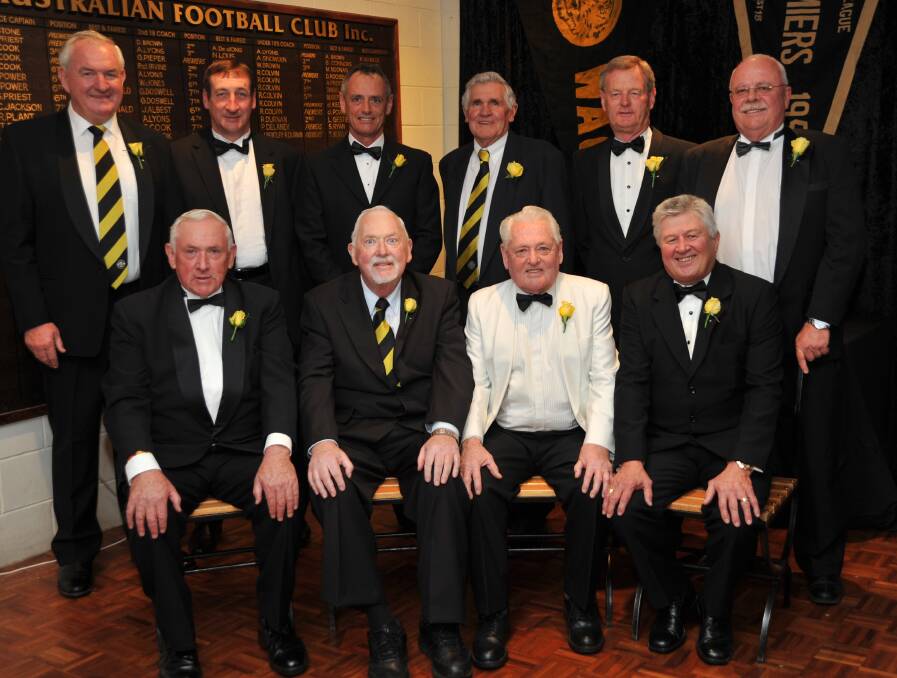 Ron Barber, standing out in his white coat, at a 2010 Wagga Tigers function with (back row) Doug Priest, Ray Carroll, Scott Oehm, Clive Willis, Peter Friedlieb, Gerry McCormack and (front row) John Bance, Robert Hughes and John Bagley. 
