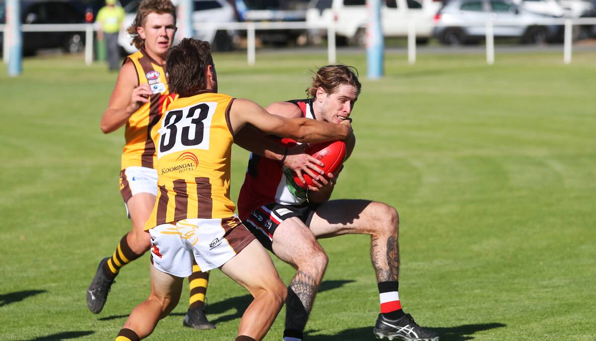 IMPORTANT ROLES: East Wagga-Kooringal midfielder Harry Fitzsimmons keeps North Wagga star Corey Watt on a tight leash. Both are key to their sides.