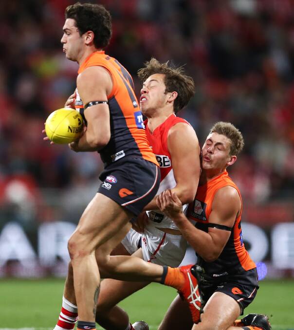 Harry Perryman (right) in action for the Giants in their last loss to the Swans. Picture: AAP