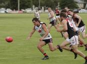 CALM: North Wagga coach Cayden Winter looks to pounce on a loose ball in the Farrer League game against Marrar at McPherson Oval on Saturday. Picture: Madeline Begley
