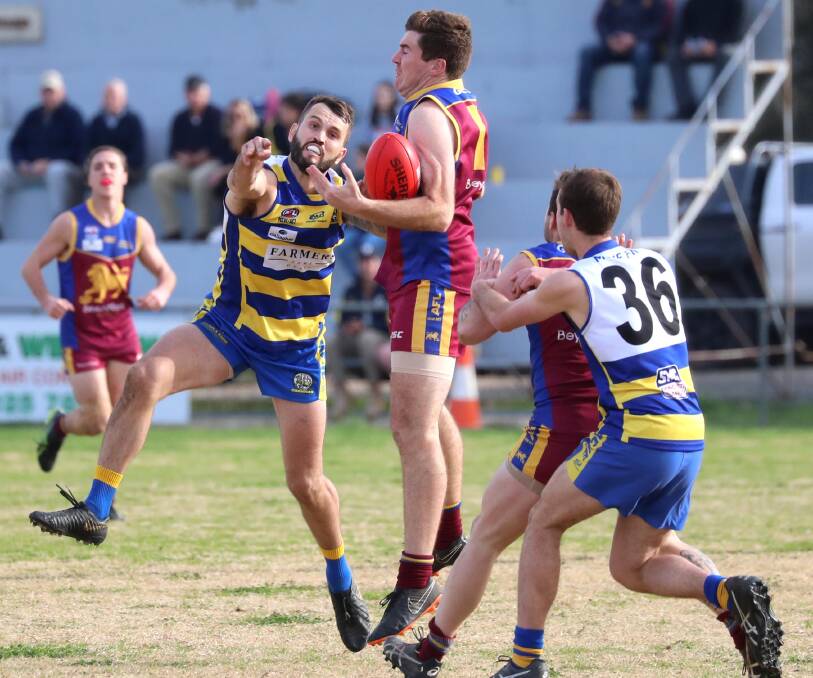 Tim Smith tries to stop Ganmain-Grong Grong-Matong forward Ben Walsh last season. Picture: Les Smith