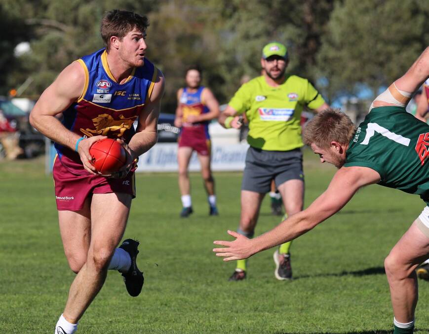 SITTING OUT: Ganmain-Grong Grong-Matong's Jacob Olsson on the move in a derby against Coolamon a couple of years ago. The ruckman has pulled out of round one against Turvey Park and potentially the season.