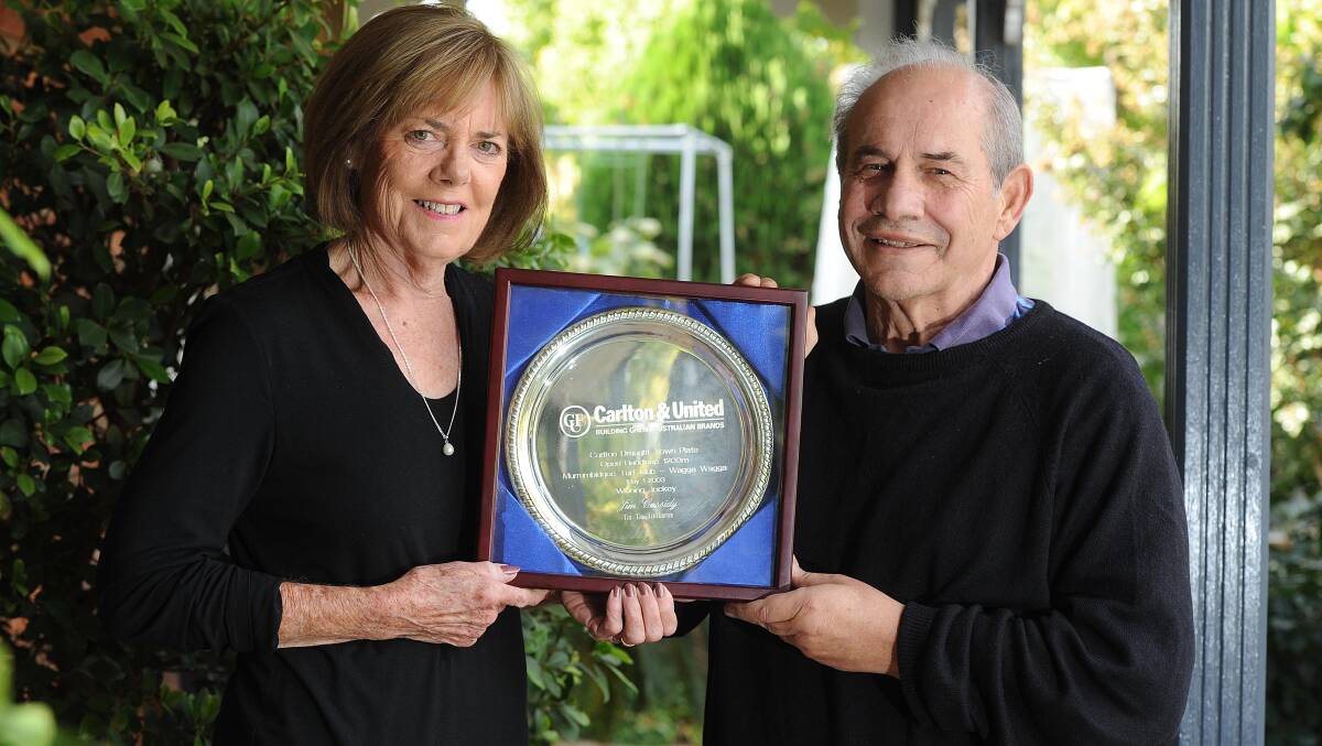 Colleen and John Mavroudis with the 2003 Town Plate, given to them by Jimmy Cassidy. Picture: Laura Hardwick