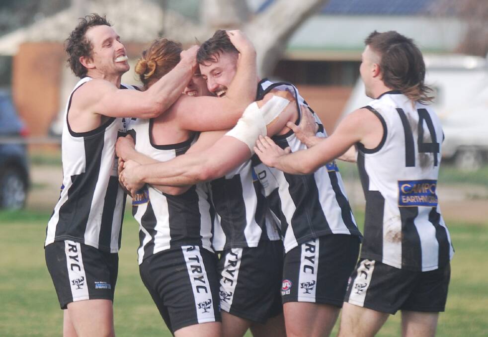 SWEET VICTORY: Tom Collins is swamped by teammates Todd Hannam, Harri White, Dean Biermann and Jordan Kemp after his last-minute goal to seal an important win. Picture: Sean Cunningham