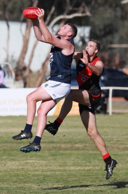 IN FRONT: Morton in a marking contest with star Marrar forward James Lawton two weeks ago. Picture: Les Smith