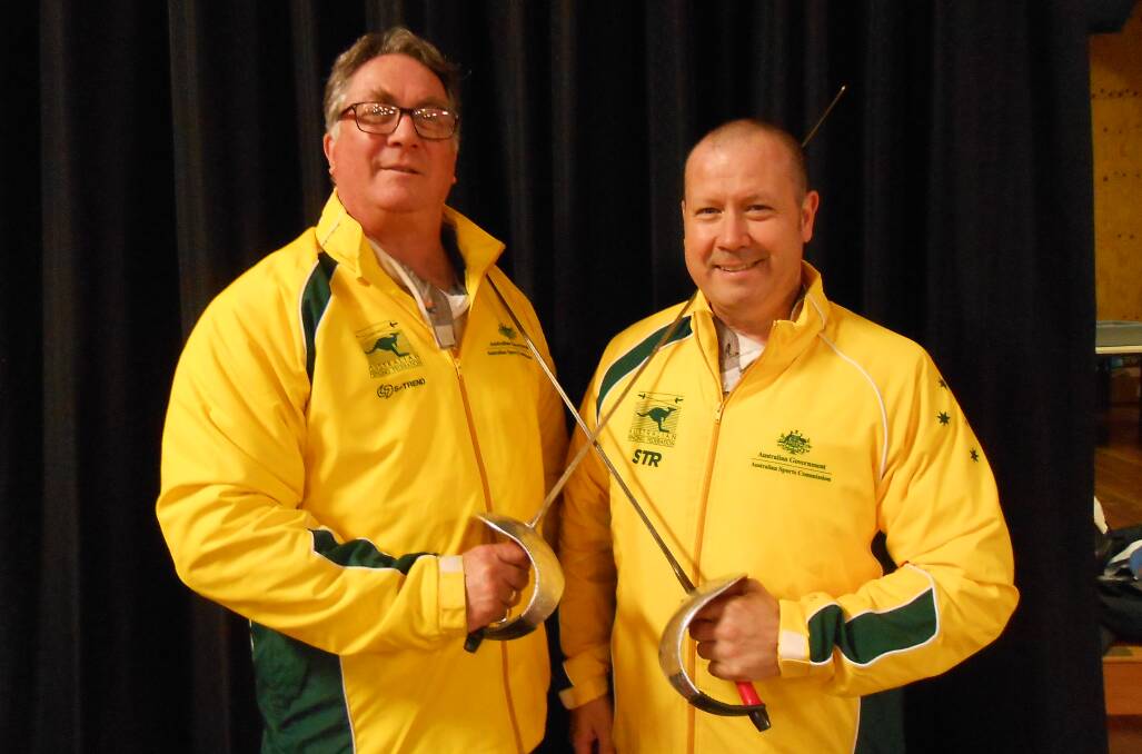 NATIONAL HONOURS: Julian Smith (left) and Toby Perry in their national tracksuits after earning selection at the Commonwealth Veterans Championships later this month. 