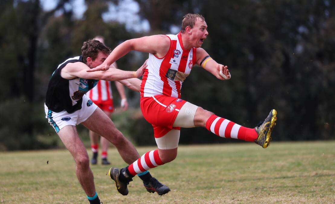 ALL SMILES: CSU backman Jack Vogan kicks the Bushpigs out of trouble against the Jets at Peter Hastie Oval on Saturday. Picture: Emma Hillier