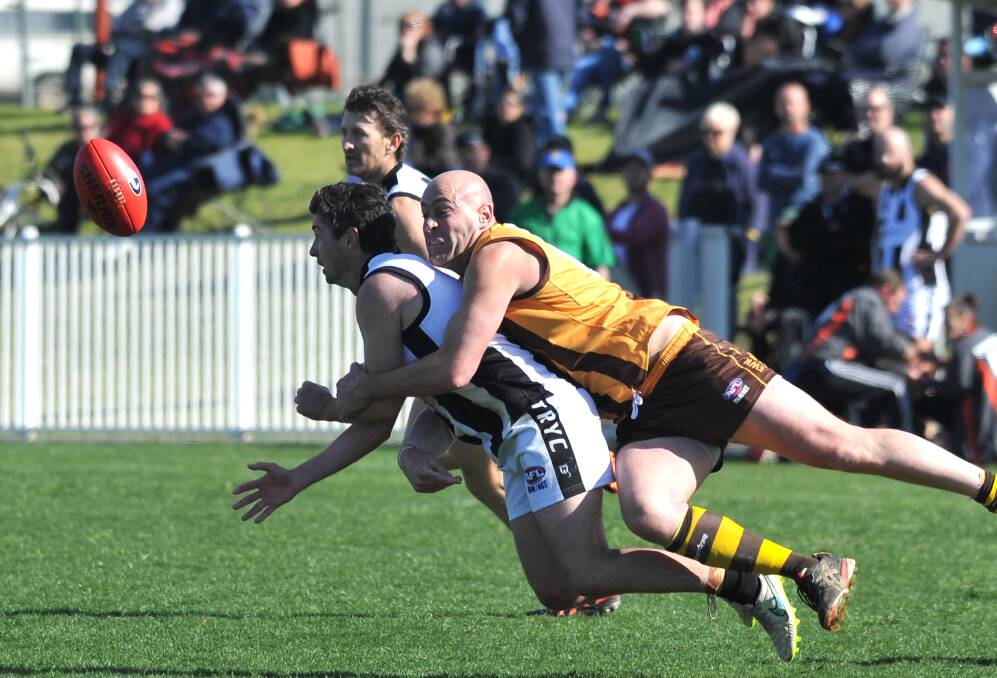 UNDER PRESSURE: The Rock-Yerong Creek's Justin Driscoll gets the ball away just as East Wagga-Kooringal's Chris Jackson brings him to ground. Picture: Laura Hardwick