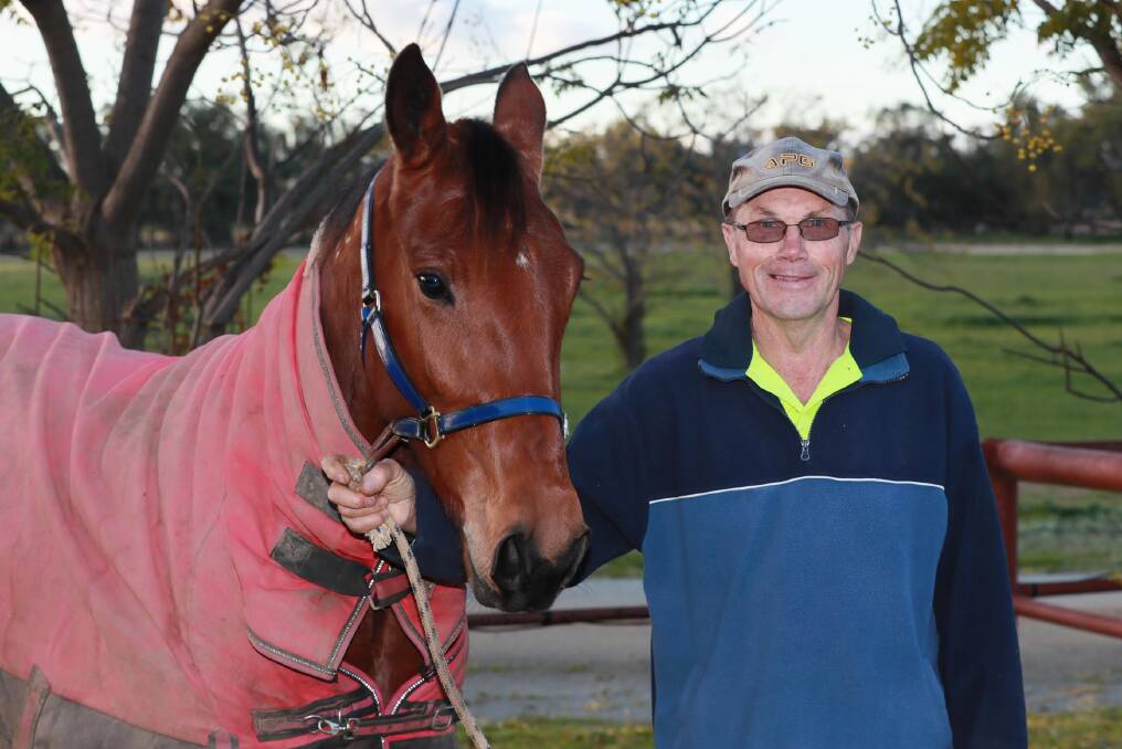 HOPING FOR LUCK: Trainer Norm Jerrick with two-year-old filly Playa Blanca ahead of Fridays meeting at Riverina Paceway. Picture: Les Smith