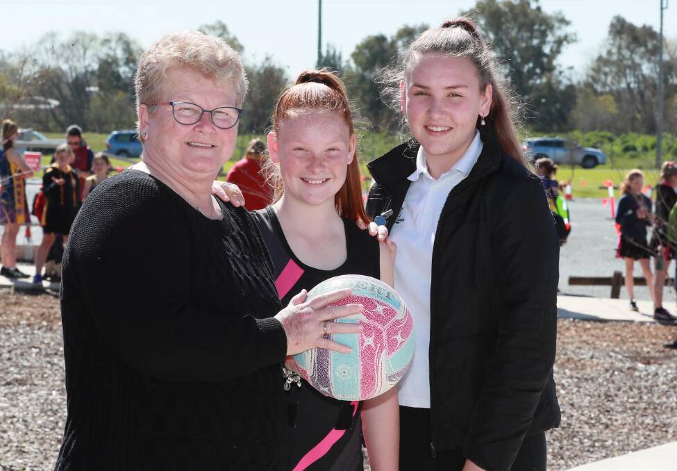 FAMILY TIME: Vicki Lawson, pictured with Chloe, 12, and Emily McMahon, 14, is enjoying being involved with her granddaughters' netball. Picture: Les Smith