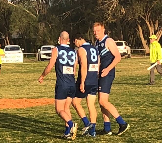 Brandon Symes (right) with Mick Lovett and Matt Wells in last week's appearance for Barellan. 