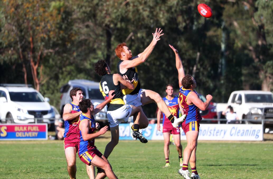 FLYING HIGH: Wagga Tigers coach Murray Stephenson goes up for a mark against Ganmain-Grong Grong-Matong at Ganmain Sportsground last Sunday. Picture: Emma Hillier