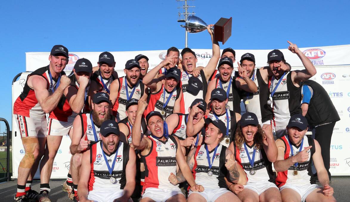 SAINTS MARCH IN: North Wagga celebrate the club's first premiership since 1994 after the 20-point win against East Wagga-Kooringal on Saturday. Picture: Les Smith