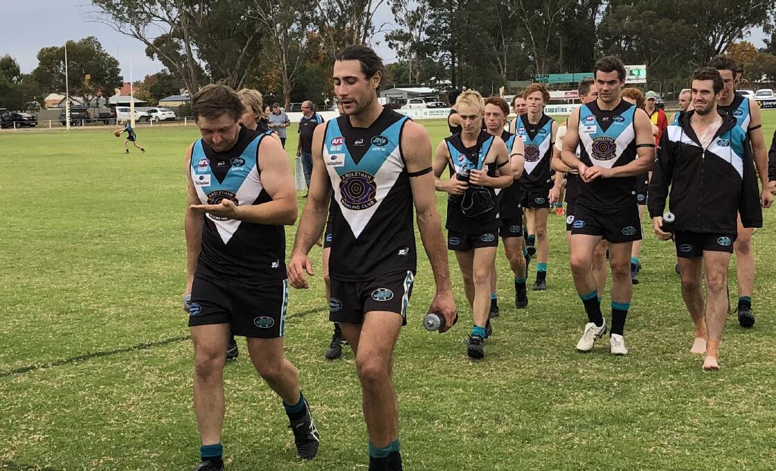 REMARKABLE CAREER: Mitch Haddrill, with his cousin Sam Fisher (left), leads the Northern Jets
off at Ariah Park last year. The star midfielder won't be back this year, hanging up the boots at 28.
