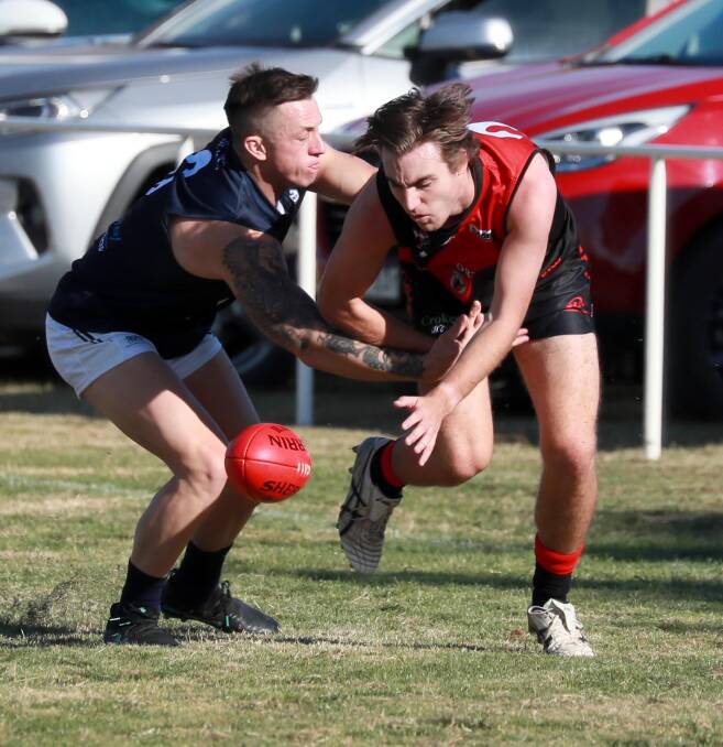 CLOSING IN: Coleambally's Theo Valeri tries to stop Marrar's Hugh Templeton at Langtry Oval on Saturday. Picture: Les Smith