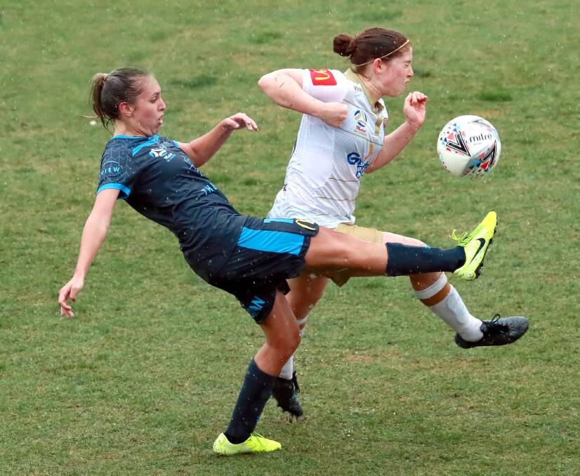 ELITE LEVEL: Sydney FC's Mackenzie Hawkesby and Newcastle Jets' Annabel Martin in the W-League pre-season game in Wagga in November. Picture: Les Smith