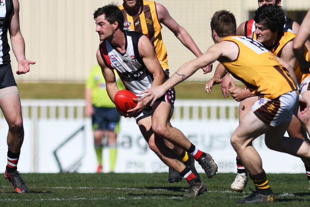 DISAPPOINTED: North Wagga midfielder Cayden Winter taking on East Wagga-Kooringal in the 2019 finals series. There hasn't been a Farrer League premiership opportunity for two years since the Saints downed the Hawks.