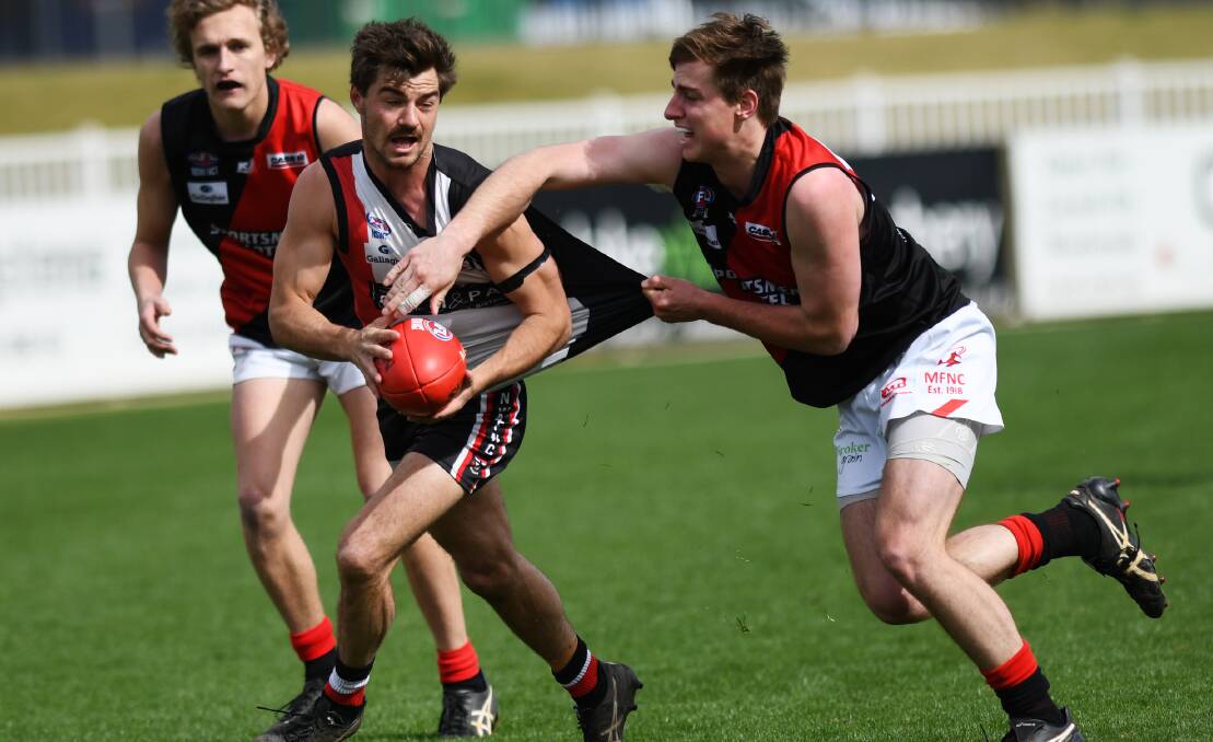 FAMILIAR FACE: Rhys Mooney (right) tries to shutdown North Wagga's Cayden Winter in last year's preliminary final. Mooney will be back in black and red this season.